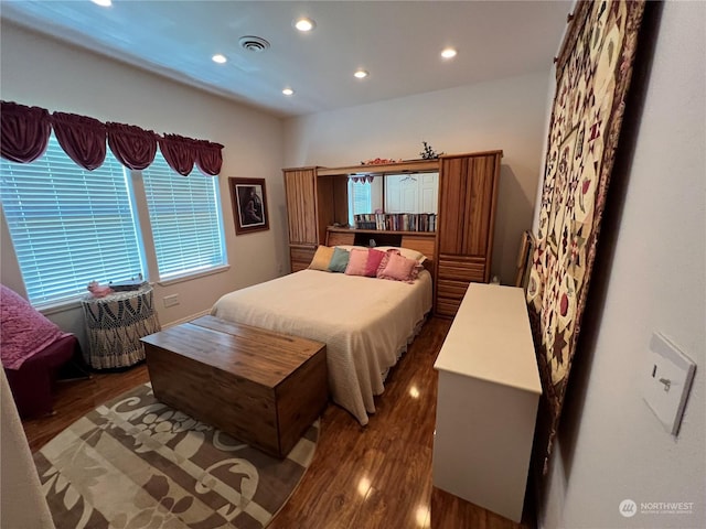 bedroom featuring dark wood-type flooring