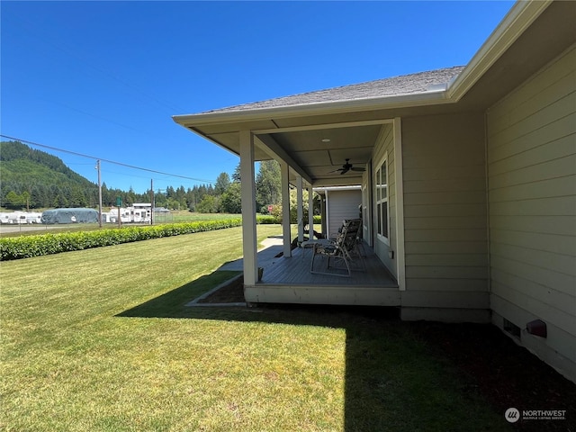 view of yard featuring ceiling fan