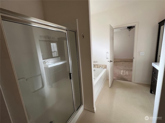 bathroom featuring plus walk in shower and vanity