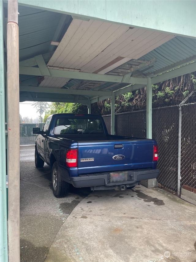 view of parking / parking lot with a carport