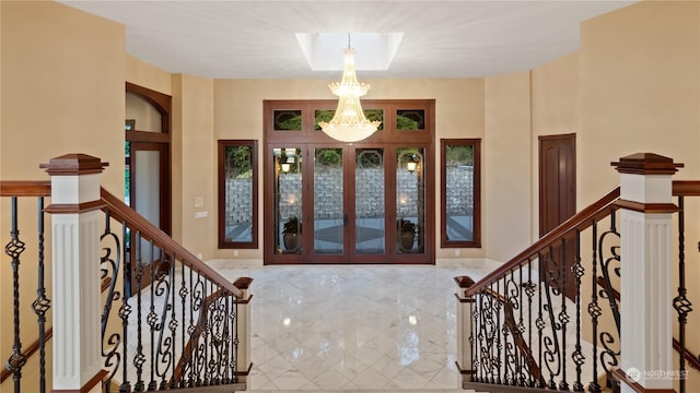 foyer entrance featuring an inviting chandelier