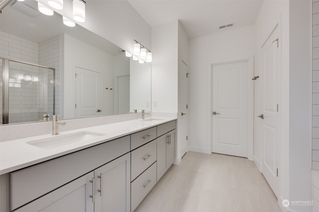 29209 217th Pl SE Unit 30, Black Diamond, WA 98010 - full bathroom with a stall shower, double vanity, a sink, and visible vents