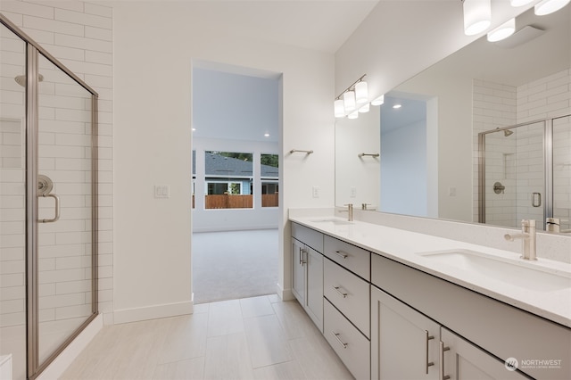 29209 217th Pl SE Unit 30, Black Diamond, WA 98010 - full bathroom with a shower stall, double vanity, a sink, and baseboards
