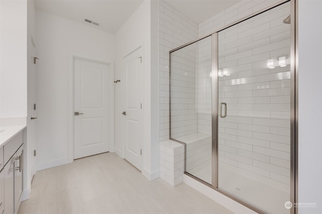 29209 217th Pl SE Unit 30, Black Diamond, WA 98010 - bathroom featuring a shower stall, vanity, baseboards, and visible vents