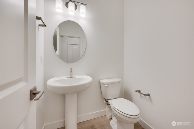 29209 217th Pl SE Unit 30, Black Diamond, WA 98010 - bathroom featuring a sink, toilet, wood finished floors, and baseboards