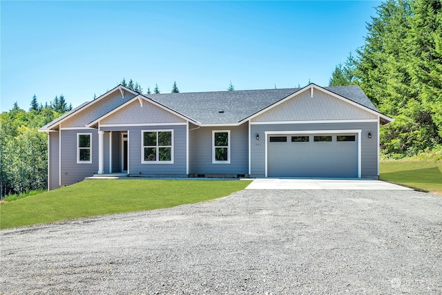 view of front facade featuring a front lawn and a garage