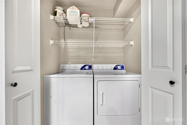 laundry room with washer and dryer