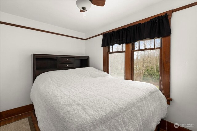 bedroom featuring wood-type flooring and ceiling fan