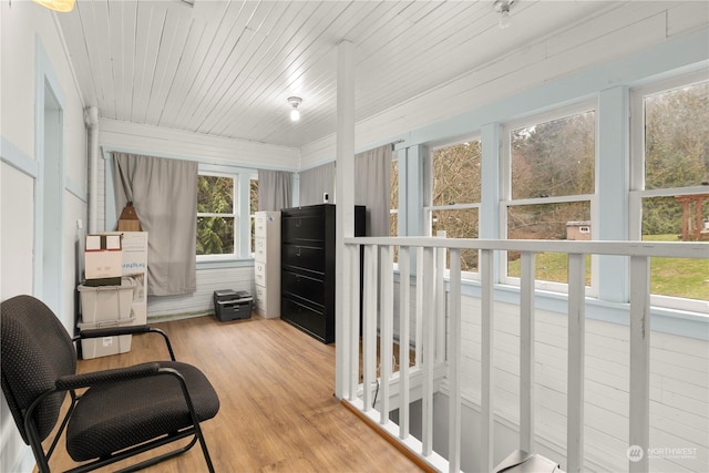 sunroom with wood ceiling and plenty of natural light