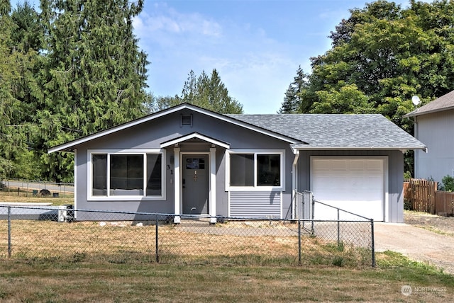 view of front of property featuring a garage and a front yard