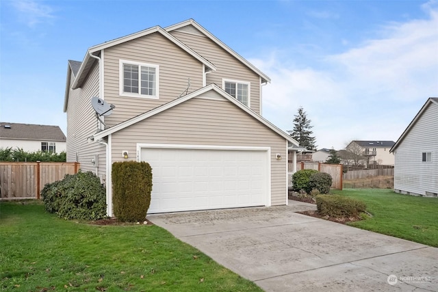 view of property featuring a front lawn and a garage