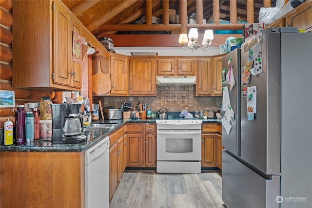 kitchen with vaulted ceiling with beams, white appliances, an inviting chandelier, decorative backsplash, and light wood-type flooring