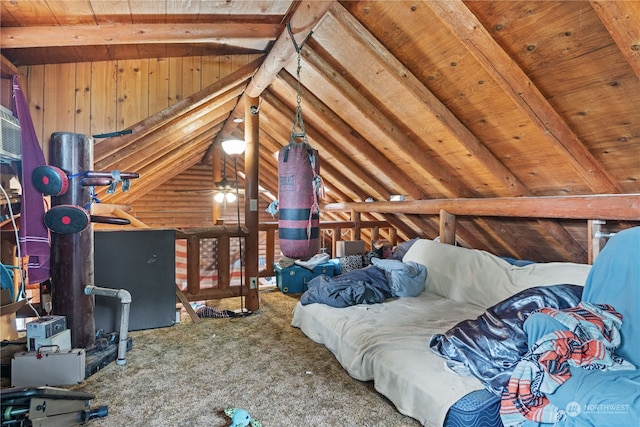 bedroom with wooden walls, lofted ceiling with beams, wood ceiling, and carpet floors