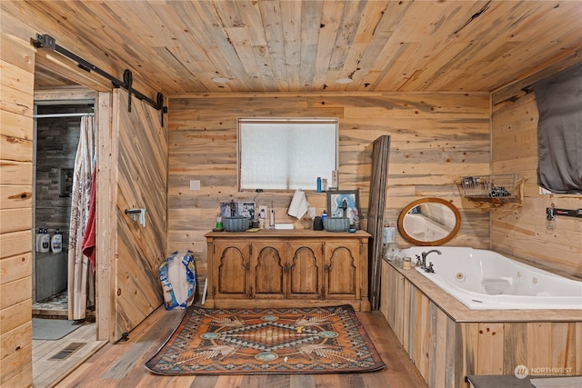 bathroom with wood walls, wooden ceiling, hardwood / wood-style flooring, and a tub to relax in