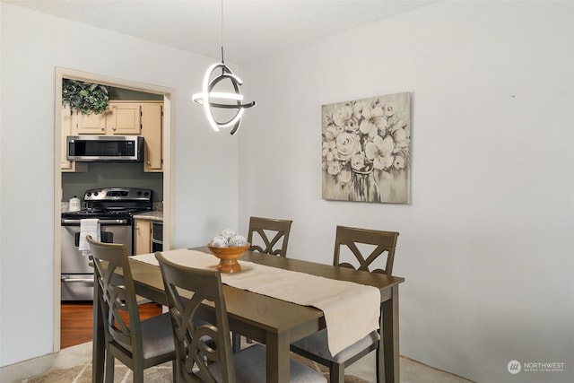 dining space with light hardwood / wood-style flooring