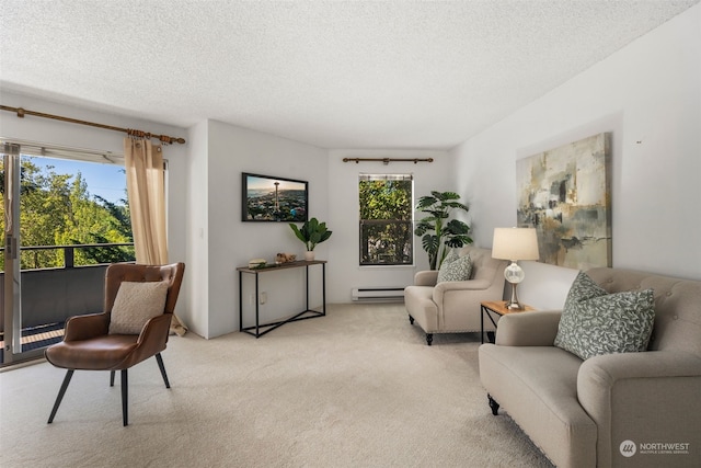 living room with a baseboard heating unit, light colored carpet, and a textured ceiling