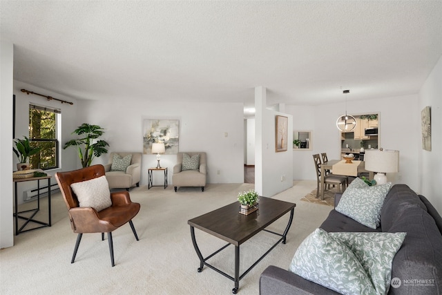 carpeted living room with a baseboard radiator and a textured ceiling