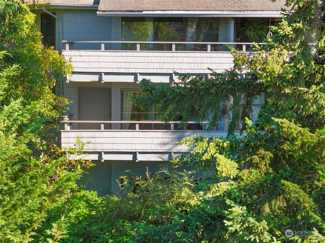 back of property with a balcony