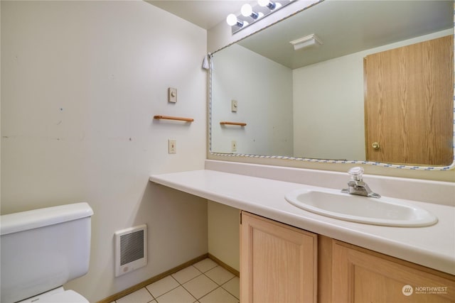 bathroom featuring toilet, tile patterned floors, visible vents, and vanity