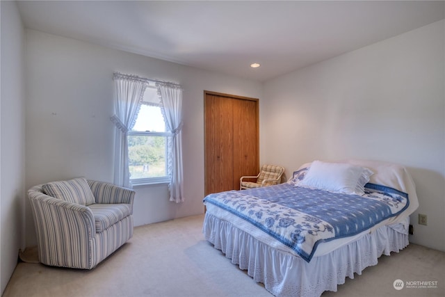 carpeted bedroom with recessed lighting