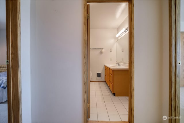 bathroom with tile patterned floors, visible vents, and vanity