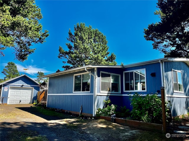 view of front of property with an outbuilding and a garage