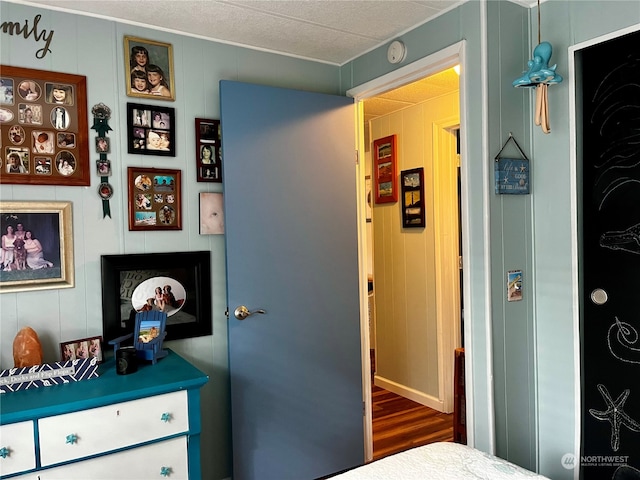 bedroom with dark hardwood / wood-style flooring