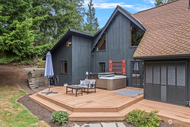 deck featuring a hot tub