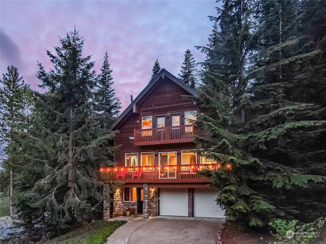 view of front of house with a balcony and a garage