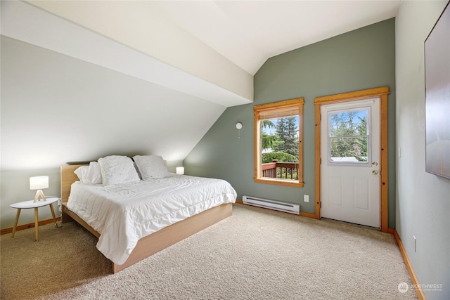 bedroom with a baseboard heating unit, vaulted ceiling, and carpet flooring