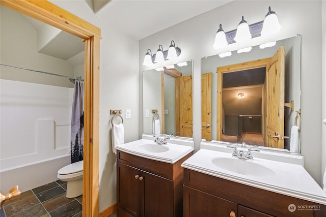 full bathroom featuring vanity, shower / tub combo, and toilet