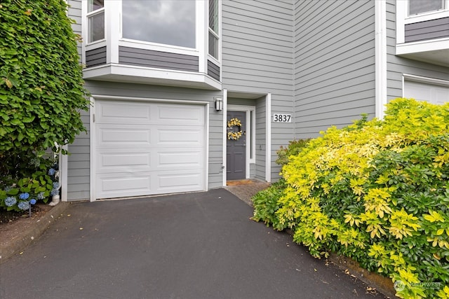 property entrance with a garage