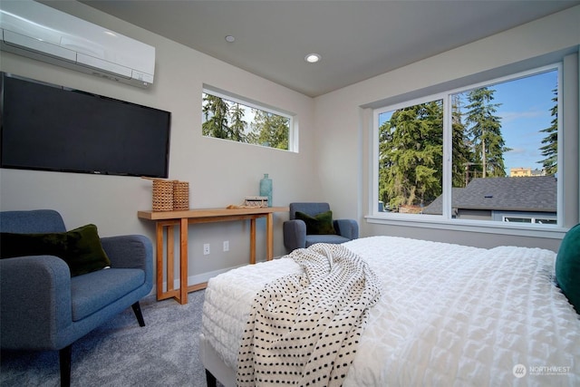 carpeted bedroom featuring a wall unit AC