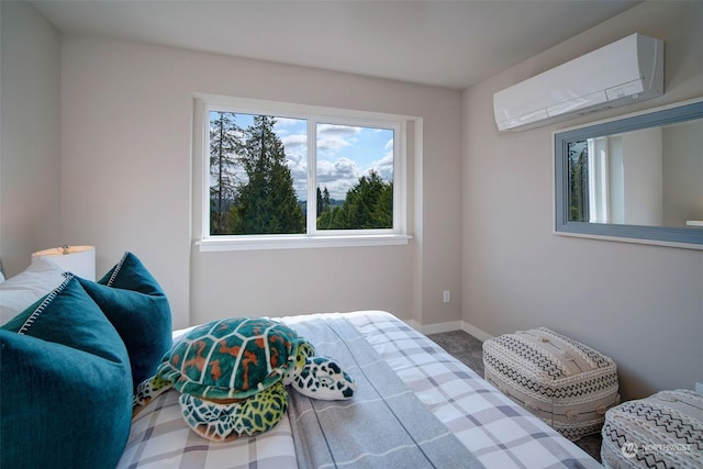 carpeted bedroom featuring a wall unit AC