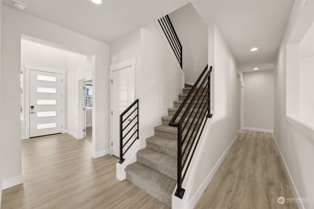 foyer entrance with light wood-type flooring