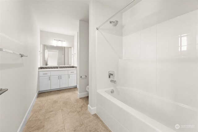 full bathroom featuring shower / tub combination, vanity, and toilet