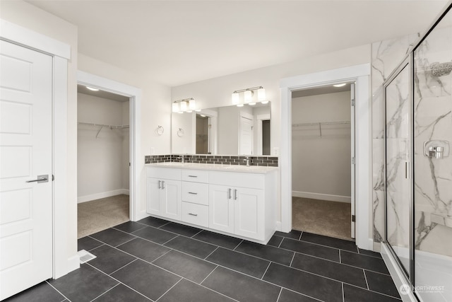 bathroom with vanity, tile patterned floors, and walk in shower