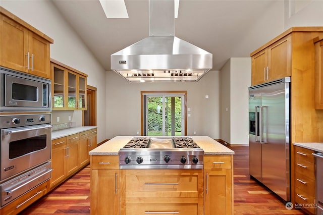 kitchen featuring a kitchen island, ventilation hood, stainless steel appliances, light stone countertops, and light wood-type flooring