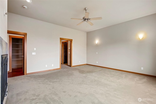 unfurnished room with light carpet and ceiling fan