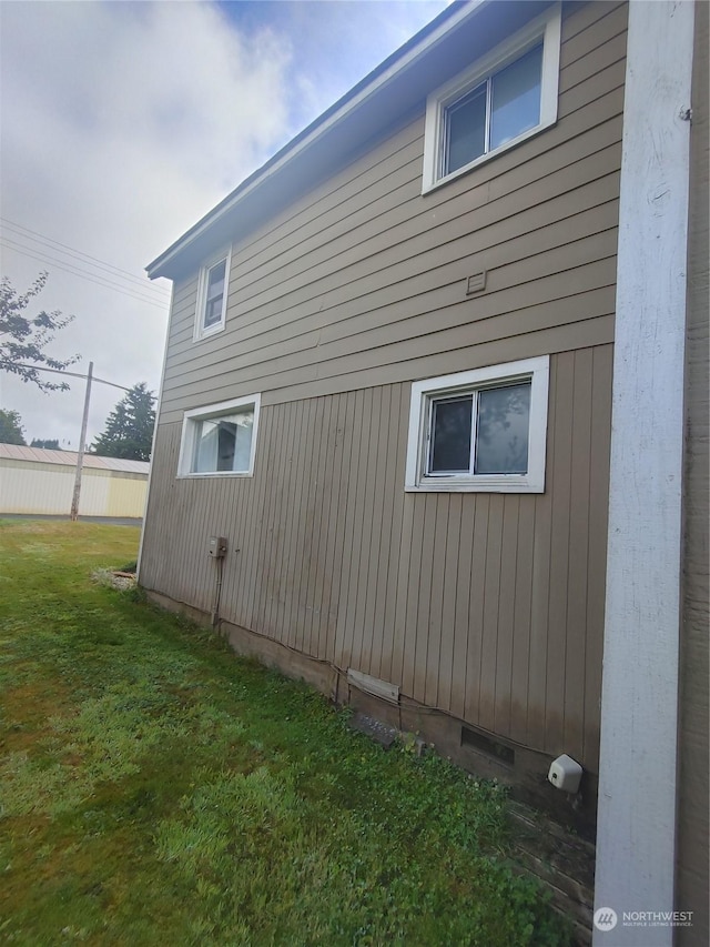 view of property exterior with crawl space and a yard