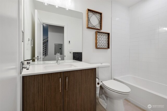 full bathroom featuring tile patterned floors, vanity, washtub / shower combination, and toilet