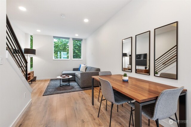 dining space with light hardwood / wood-style floors