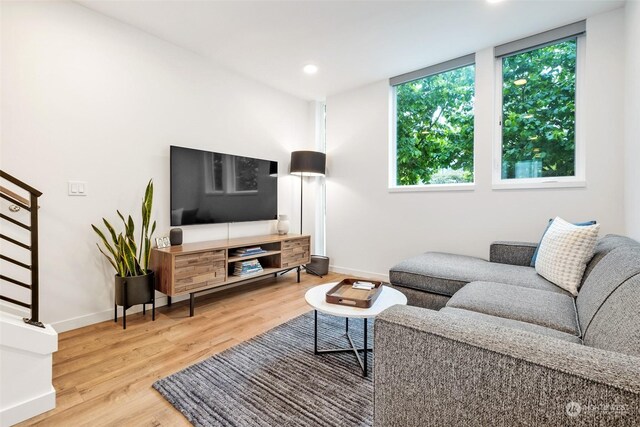 living room with light hardwood / wood-style flooring