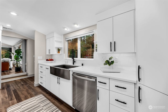 kitchen featuring lofted ceiling, dark hardwood / wood-style floors, sink, white cabinetry, and stainless steel dishwasher