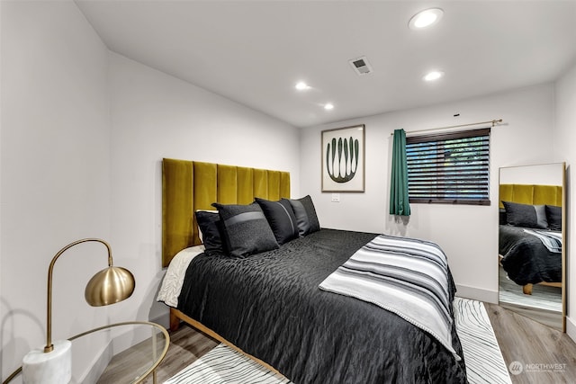 bedroom featuring hardwood / wood-style flooring