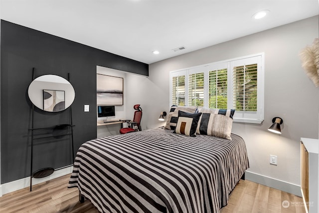 bedroom with light wood-type flooring