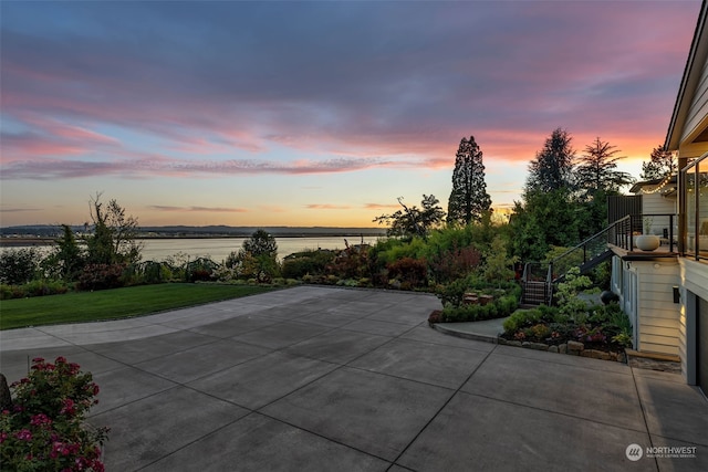 patio terrace at dusk with a water view