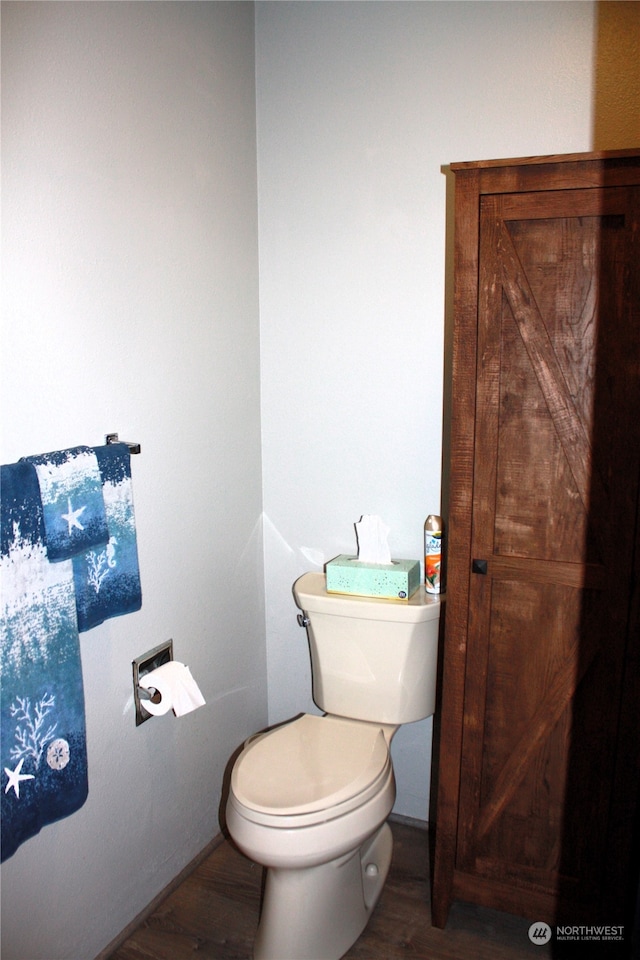 bathroom featuring toilet and hardwood / wood-style floors