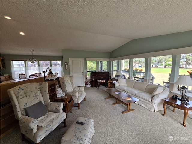 living room with a wealth of natural light, lofted ceiling, and carpet flooring