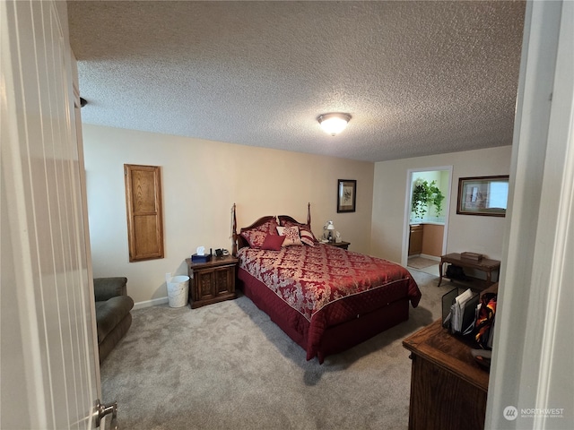 carpeted bedroom with a textured ceiling